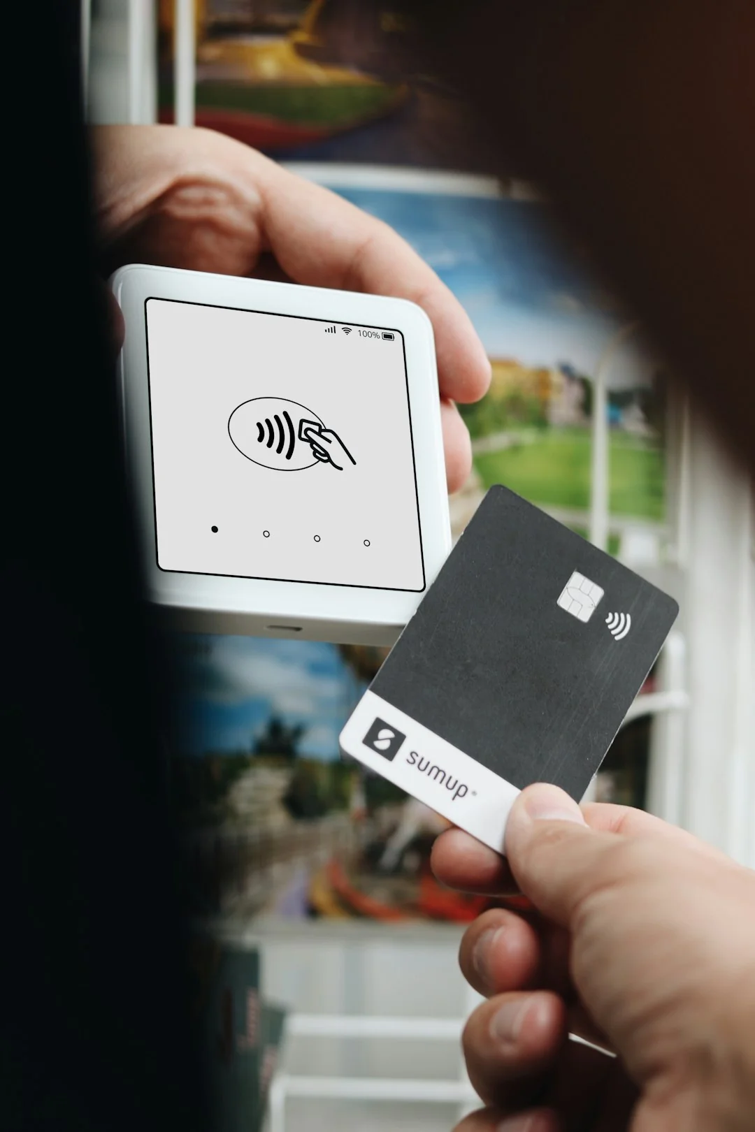 Close-up of an engraved metal business card with a QR code